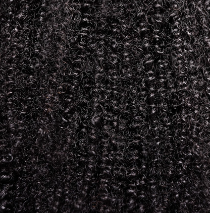 Close-up view of the Silva Bundle featuring a kinky-coily texture with bold and voluminous curls.