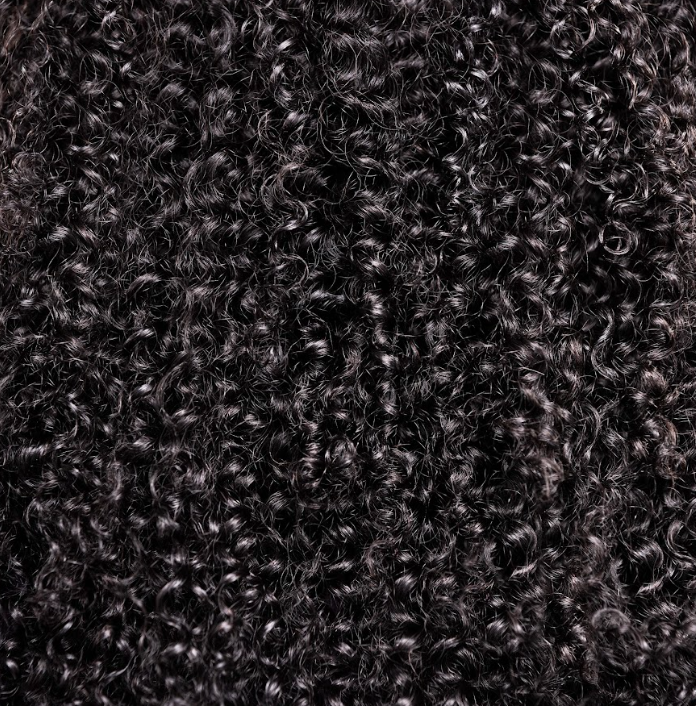 Close-up view of the Staci Bundle highlighting its defined, bouncy curls with a soft and natural texture.